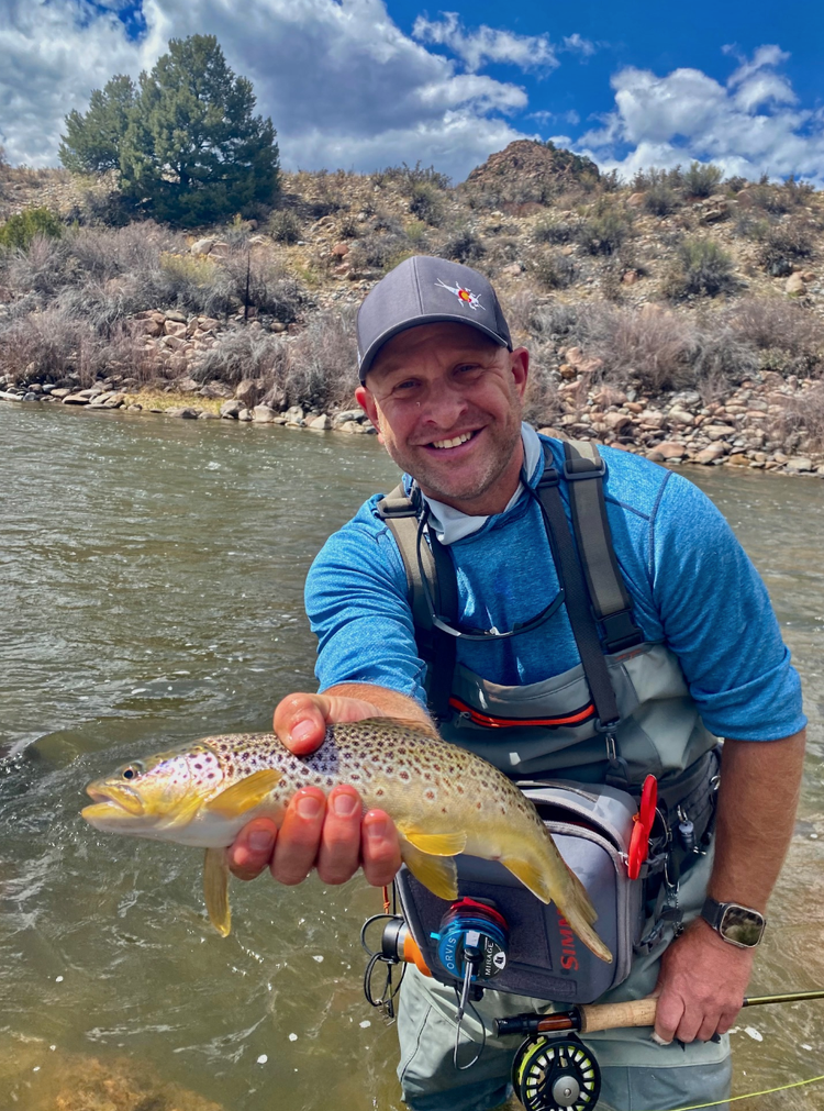 Jonathan Haas outdoors beside a Colorado river